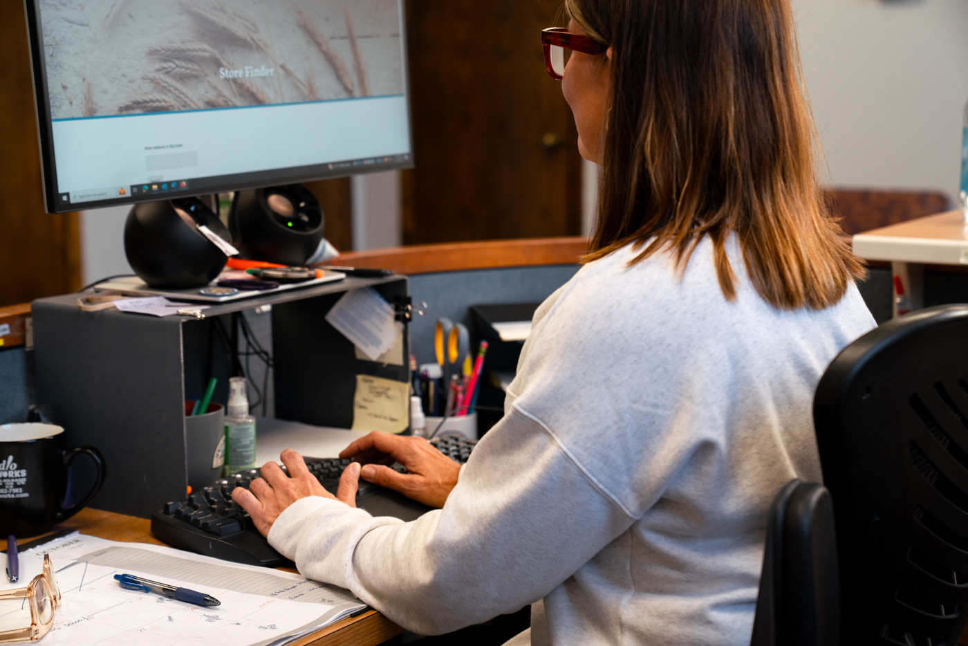 Woman sitting at desktop computer